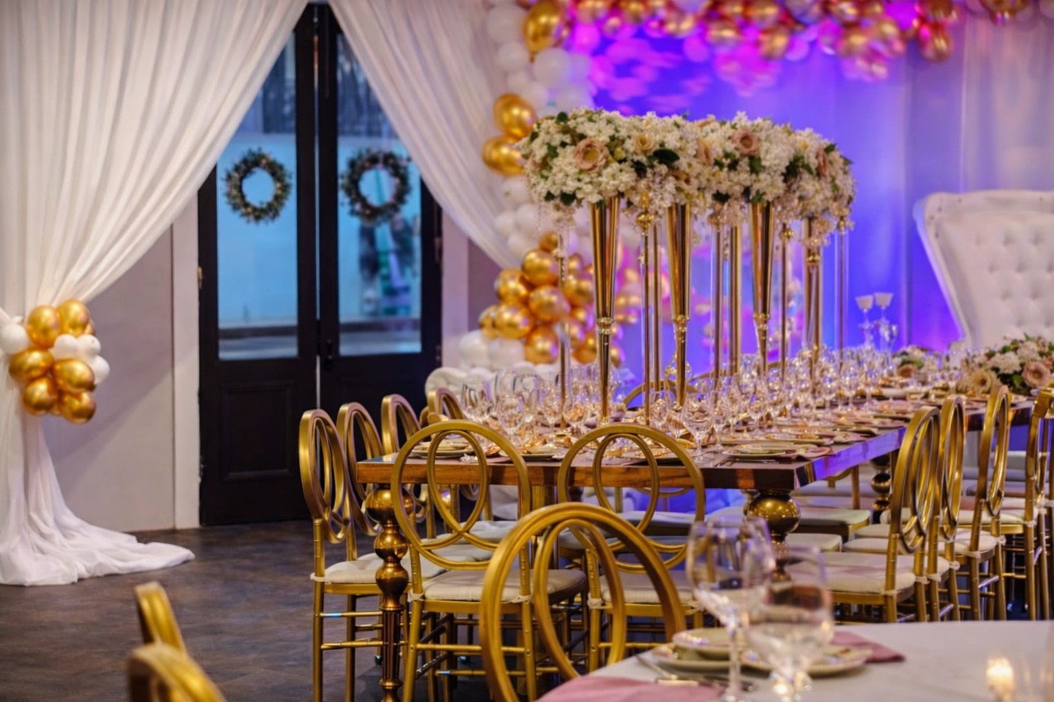 Elegant gold and floral event tablescape at The 1889
